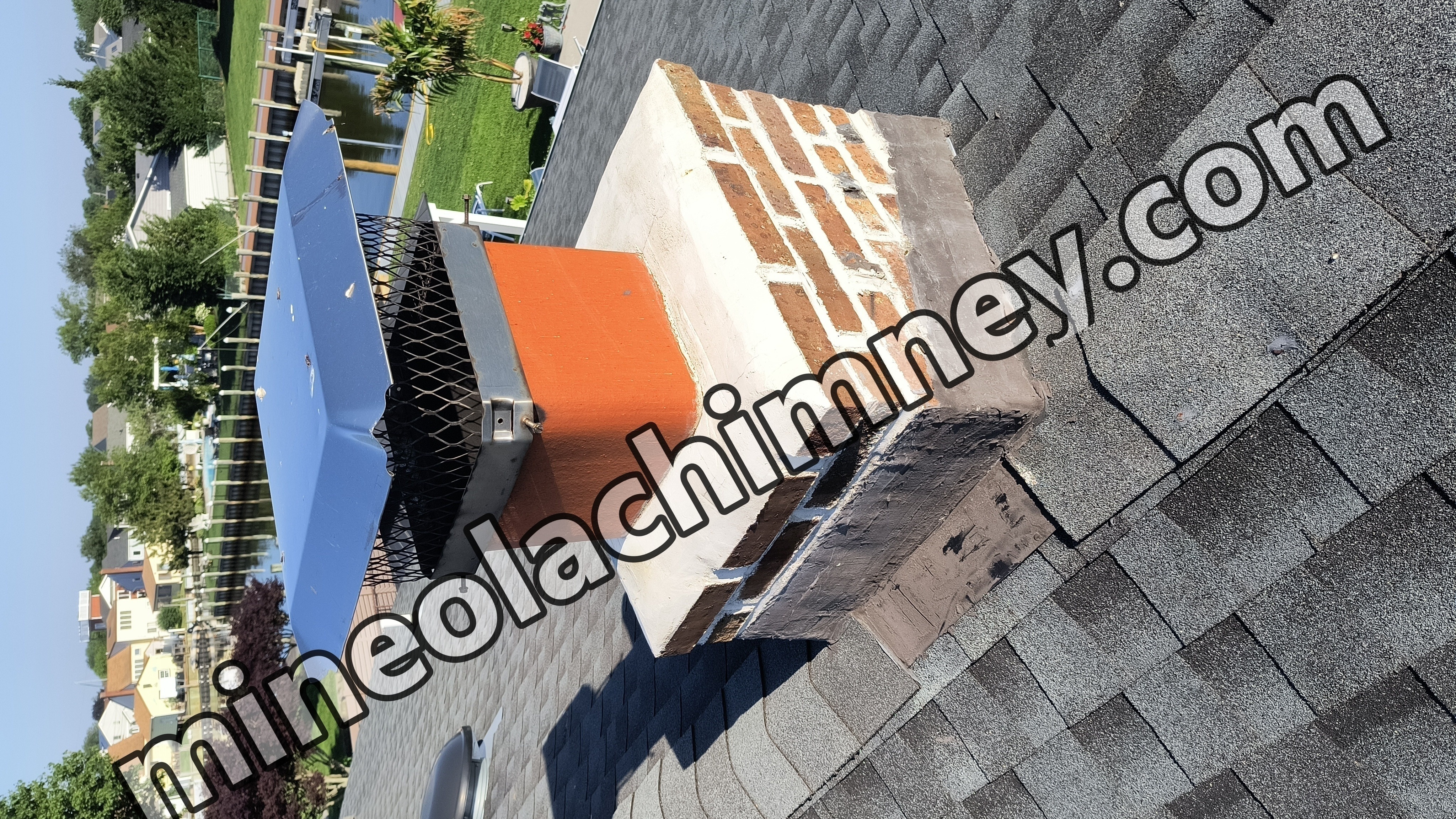 Full chimney masonry rebuild and restoration in Mineola, NY